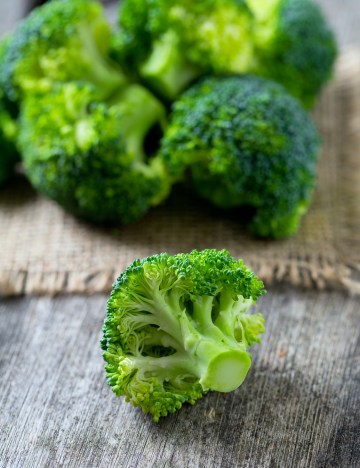 broccoli on wooden surface