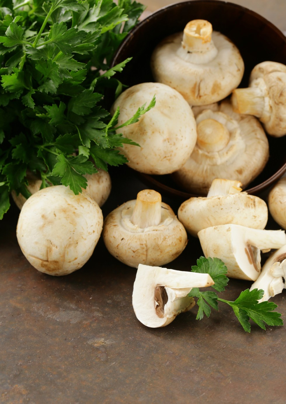 natural organic raw mushrooms champignons on table