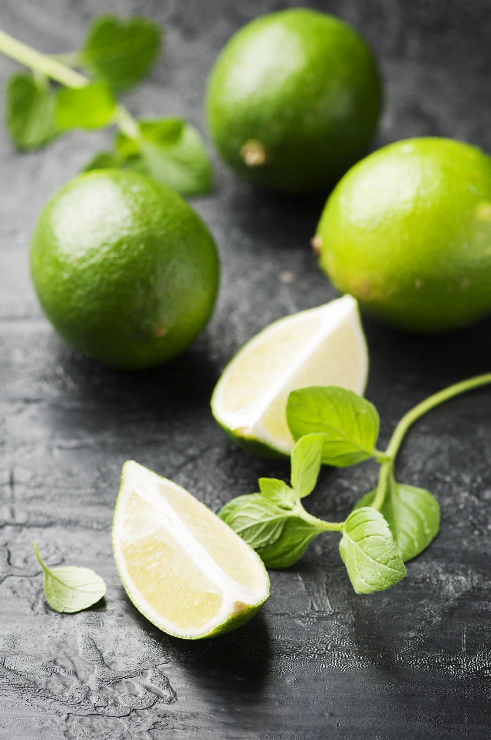 Fresh lime and mint on the black table