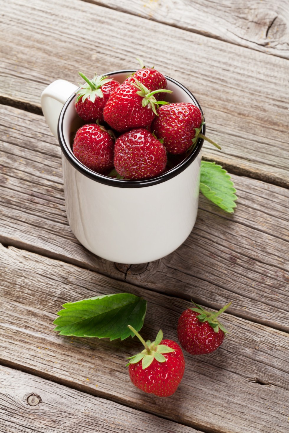 Fresh garden strawberry in cup